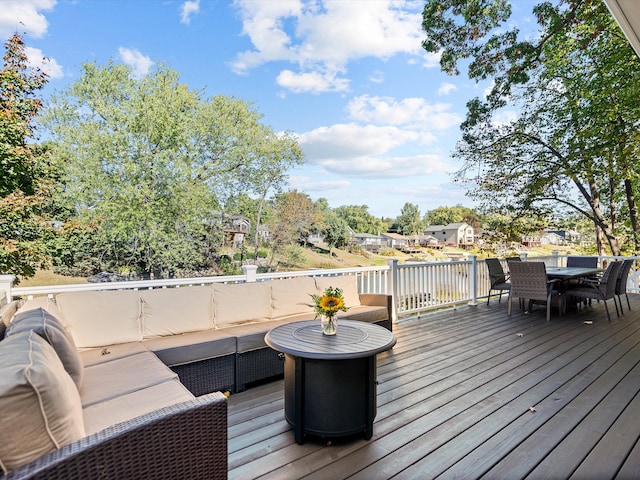 wooden terrace featuring outdoor lounge area