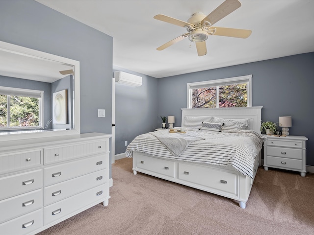 bedroom with an AC wall unit, multiple windows, ceiling fan, and light carpet