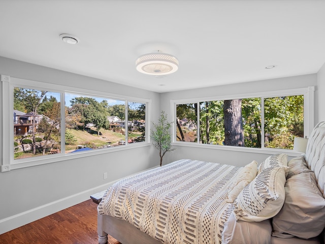 bedroom with hardwood / wood-style flooring