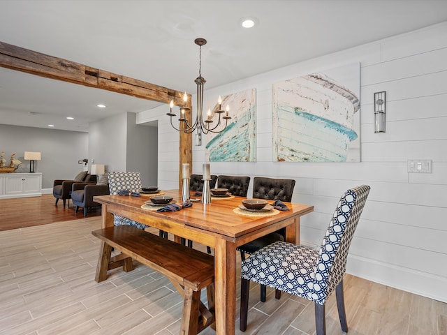 dining room featuring light hardwood / wood-style flooring and a chandelier