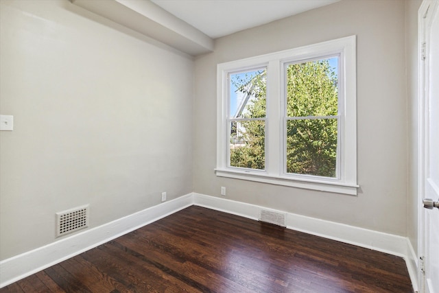 empty room with dark wood-type flooring