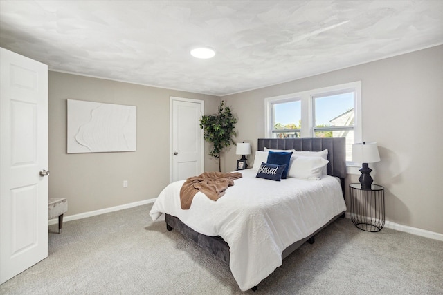 bedroom featuring light carpet