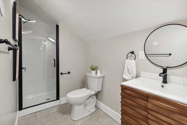 bathroom featuring tile patterned floors, a shower with door, vanity, and toilet