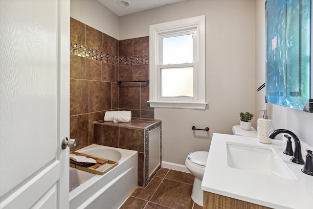 full bathroom featuring tile patterned flooring, vanity, toilet, and tiled shower / bath combo