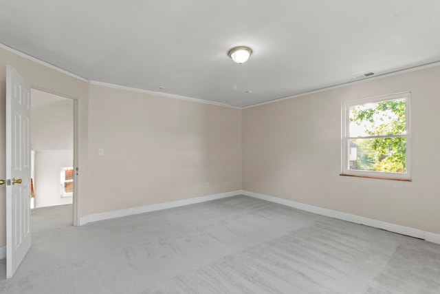 spare room with light carpet and ornamental molding