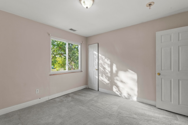 empty room with light colored carpet