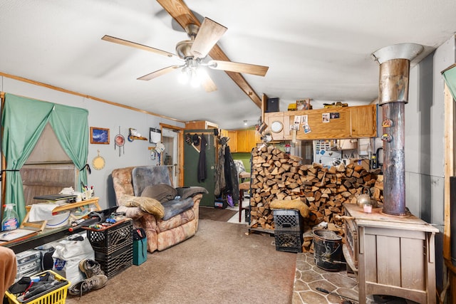 carpeted living room with ceiling fan and vaulted ceiling