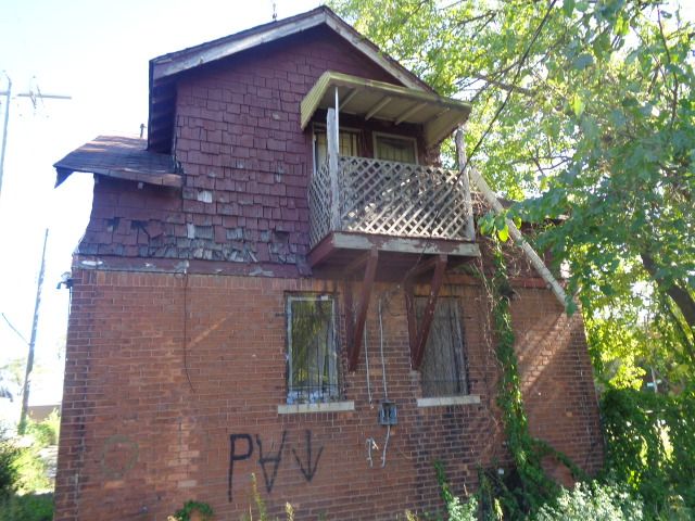 16017 San Juan Dr, Detroit, MI 48238 - view of home's exterior featuring a balcony and brick siding