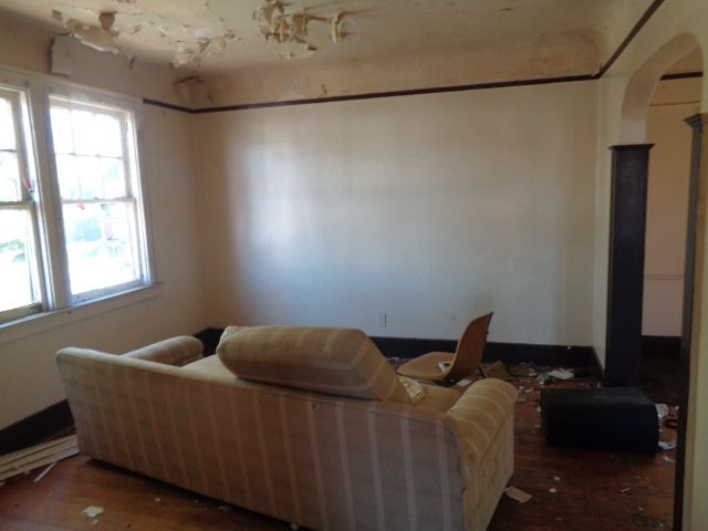 16017 San Juan Dr, Detroit, MI 48238 - living area with arched walkways and wood finished floors