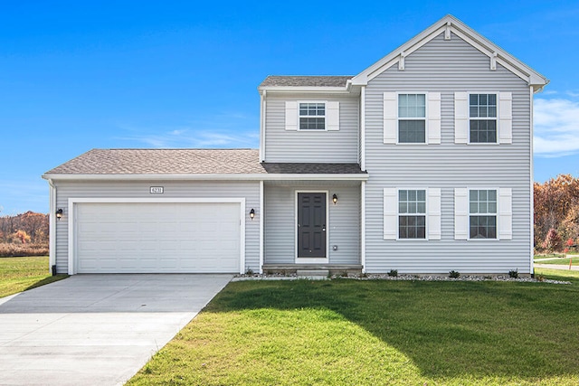 view of front property with a front yard and a garage