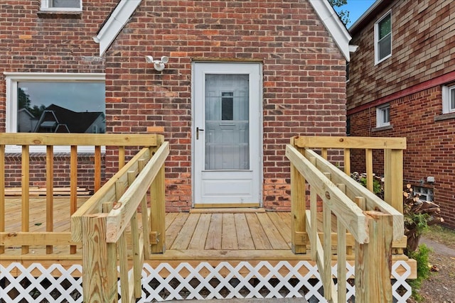 property entrance featuring a wooden deck