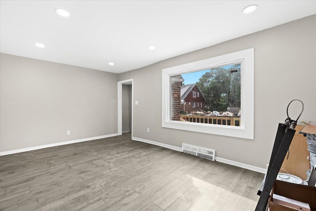 empty room featuring hardwood / wood-style flooring