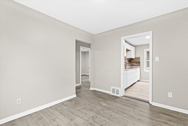 empty room featuring light hardwood / wood-style floors