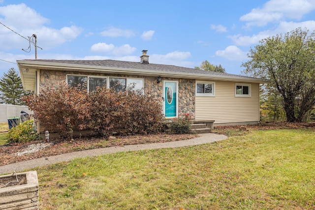 3735 S Portsmouth Rd, Bridgeport, MI 48722 - view of front facade featuring a front yard, a chimney, and stone siding