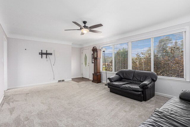 3735 S Portsmouth Rd, Bridgeport, MI 48722 - living area with ceiling fan, carpet, and baseboards