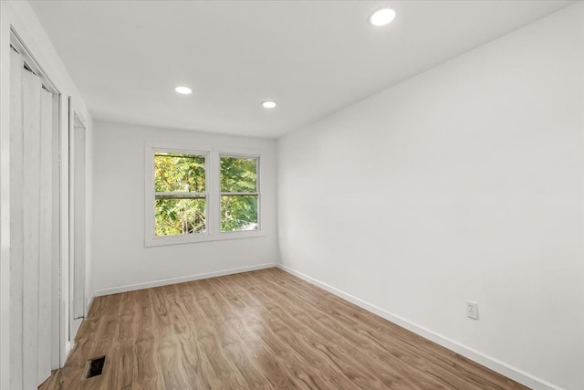 unfurnished room featuring light hardwood / wood-style floors