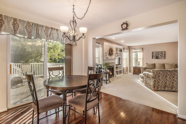 dining room featuring an inviting chandelier and hardwood / wood-style flooring