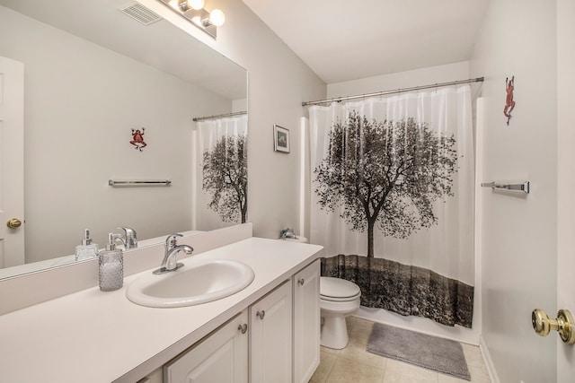 bathroom featuring tile patterned flooring, vanity, a shower with shower curtain, and toilet