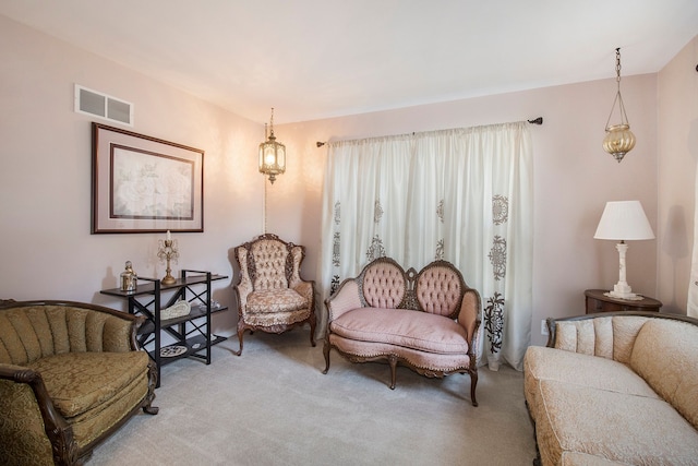 sitting room featuring carpet flooring