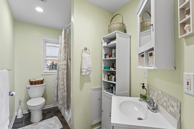 bathroom featuring tile patterned floors, vanity, a shower with shower curtain, and toilet