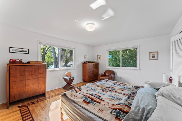 bedroom with light wood-type flooring