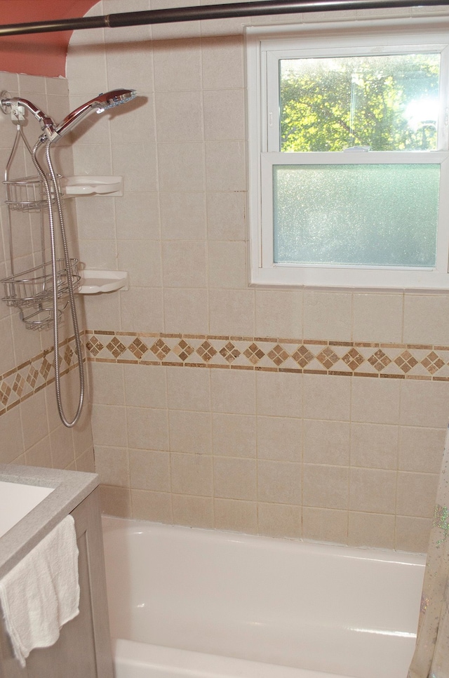 bathroom with vanity and shower / tub combo with curtain