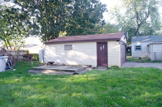 view of outbuilding featuring a lawn