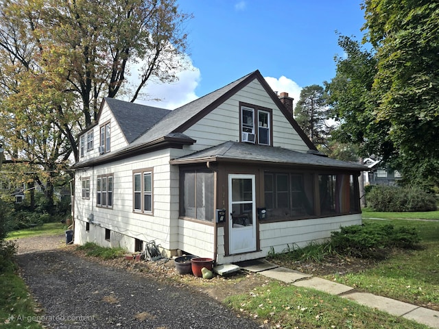 exterior space featuring cooling unit and a sunroom