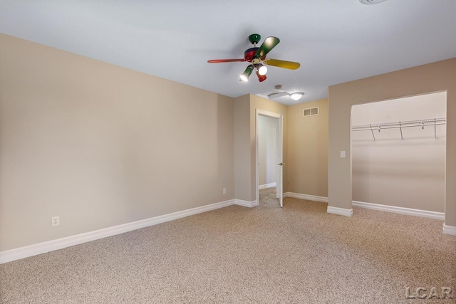 unfurnished bedroom featuring carpet, a closet, and ceiling fan