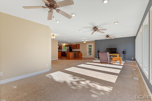 living room with light carpet and ceiling fan