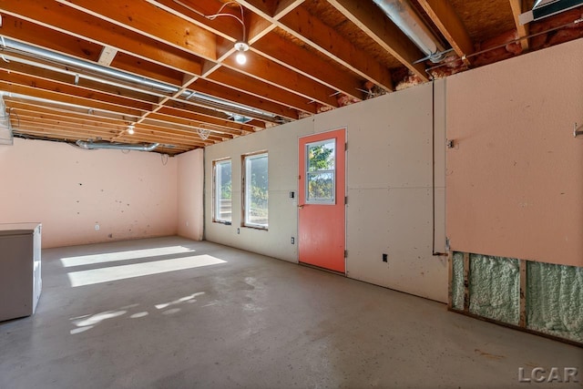 basement featuring white refrigerator