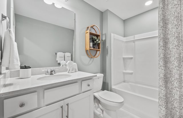 full bathroom featuring vanity, shower / bathtub combination, and toilet