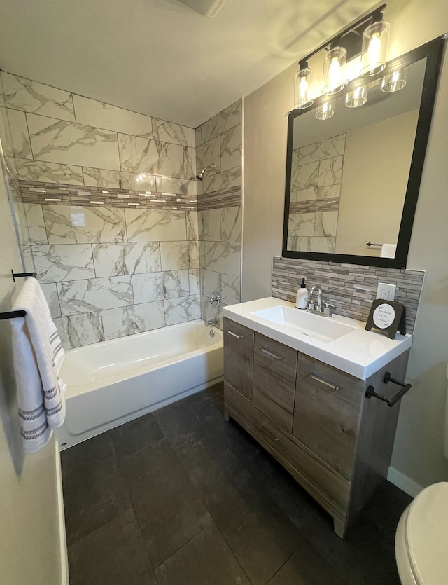 full bathroom with vanity, toilet, tiled shower / bath combo, and decorative backsplash