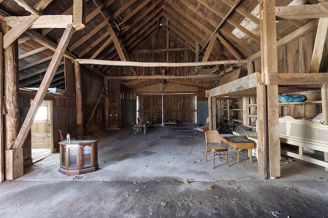 miscellaneous room with lofted ceiling