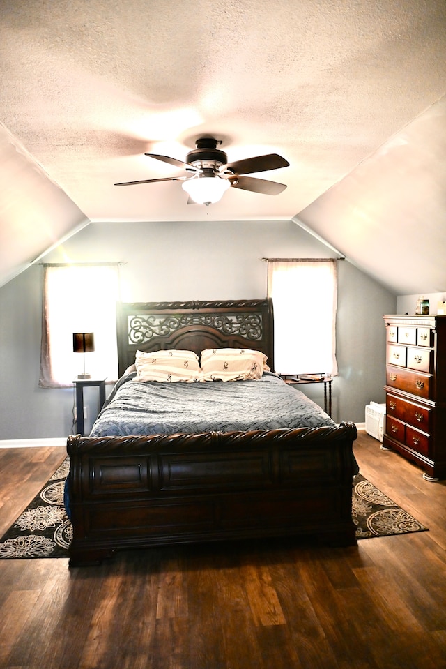 12101 Todd Rd, Ida, MI 48140 - bedroom featuring vaulted ceiling, wood finished floors, multiple windows, a textured ceiling, and baseboards