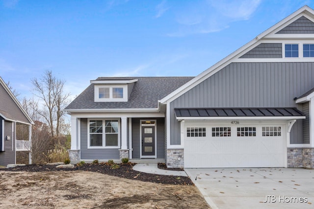 craftsman-style home with a garage