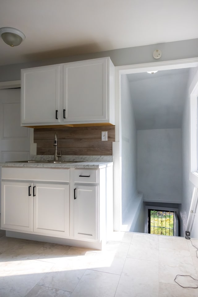 kitchen with sink and white cabinets