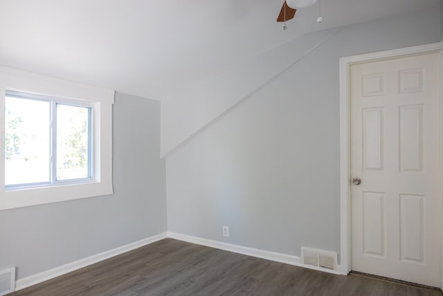 bonus room with ceiling fan, lofted ceiling, and dark wood-type flooring