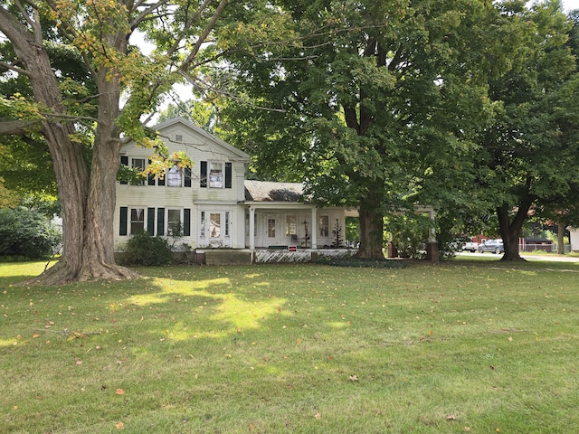 103 S Railroad St, Allen, MI 49227 - view of front of house featuring covered porch and a front lawn