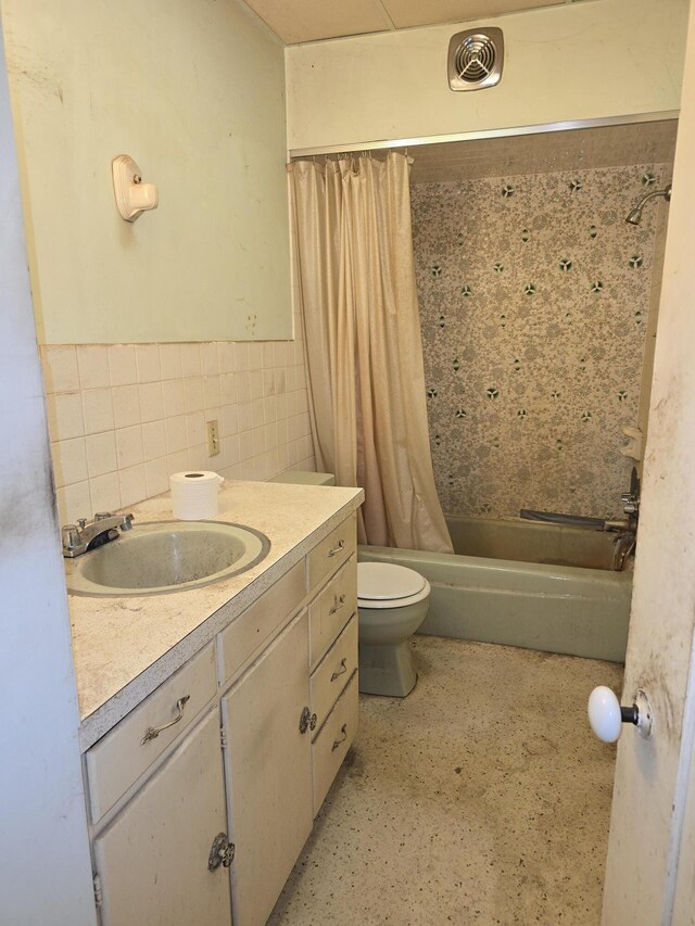 103 S Railroad St, Allen, MI 49227 - bathroom with toilet, shower / bath combination with curtain, vanity, and tile walls