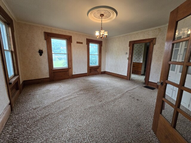 103 S Railroad St, Allen, MI 49227 - carpeted empty room with ornamental molding, a chandelier, wallpapered walls, and baseboards