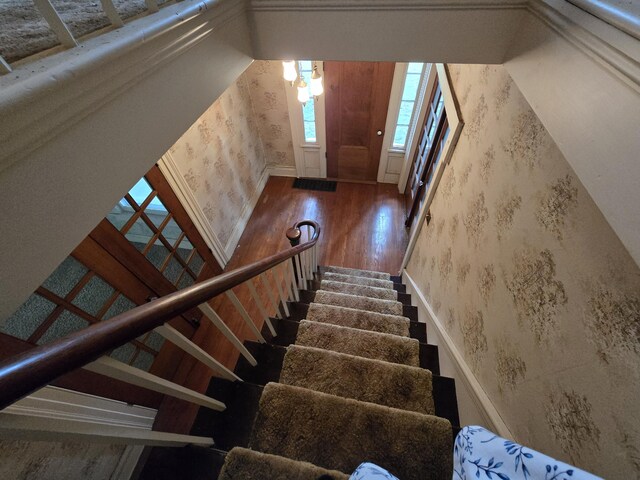 103 S Railroad St, Allen, MI 49227 - stairs featuring wallpapered walls and wood finished floors