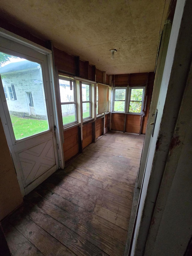 unfurnished sunroom featuring a healthy amount of sunlight