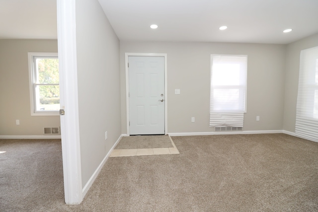 view of carpeted entrance foyer