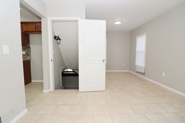 unfurnished bedroom with light tile patterned floors