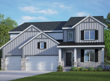 view of front of house featuring a front yard and a garage