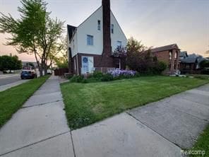 7603 Kentucky St, Dearborn, MI 48126 - view of home's exterior featuring a yard