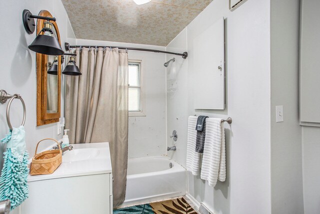 bathroom with shower / tub combo with curtain and vanity