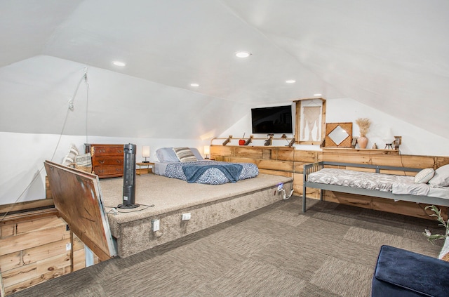 bedroom with carpet flooring and lofted ceiling