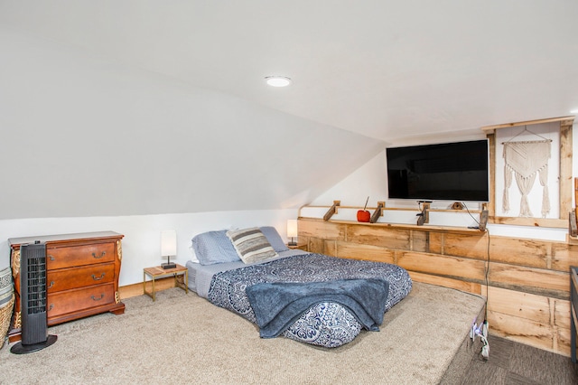 carpeted bedroom featuring vaulted ceiling